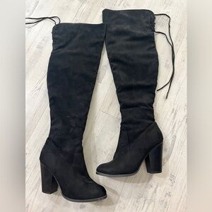 Thigh high heeled boots